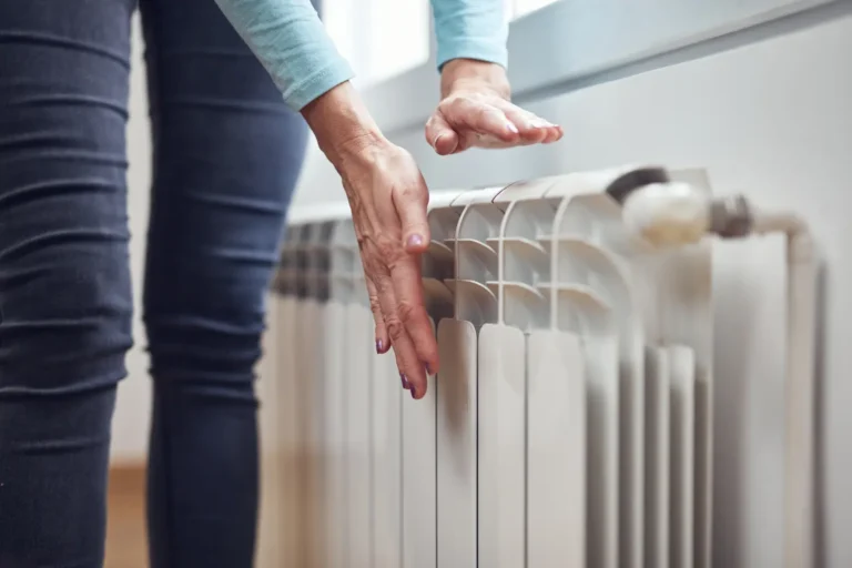 Portland OR homeowner checking heater when furnace stops working